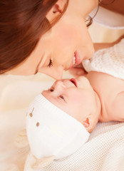 Wall Mural - Happy mother with baby