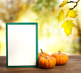 Wall Mural - greeting card with small pumpkins
