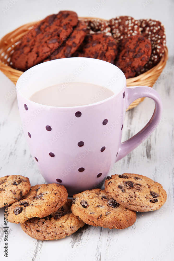 Cocoa drink and cookies on wooden background