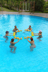 People doing exercise in a swimming pool