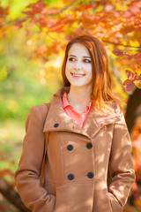 Sticker - Redhead girl in autumn park