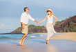 © EpicStockMedia - Middle Aged Couple Enjoying Walk on the Beach