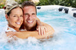 © grinny - Happy couple in jacuzzi.