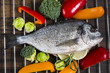 fresh dorado fish with vegetables