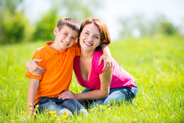 Wall Mural - Happy mother and son outdoor portrait