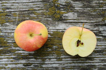 Wall Mural - Ripe apple on a wooden background