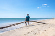 © Edler von Rabenstein - Man sitting on the beach and looks at the sea