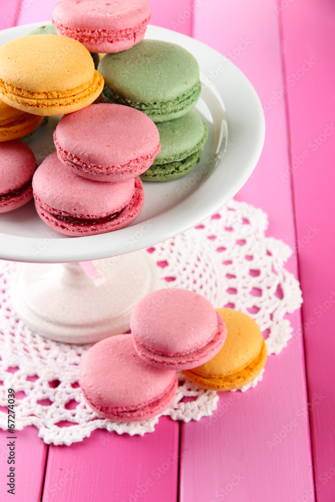 Gentle macaroons in vase on table close-up