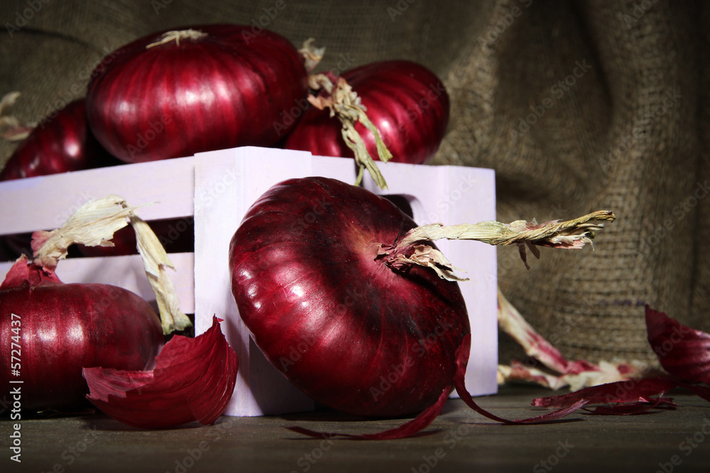 Fresh red onions in cellar