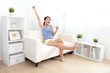 © ryanking999 - happy woman using tablet pc on sofa