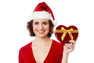 Pretty female holding wrapped gift box