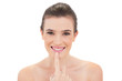 © lightwavemedia - Cheerful natural brown haired model touching her lip