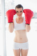 © lightwavemedia - Dynamic fit brown haired model in sportswear wearing red boxing