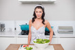 © lightwavemedia - Peaceful pretty brunette making salad