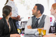 © WavebreakMediaMicro - Business people talking to the waiter