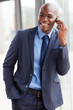 © michaeljung - african american businessman talking on cell phone