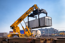 Crane Lifts A Container Loading A Train