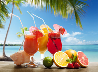 Wall Mural - cocktails and tropical fruit on the beach