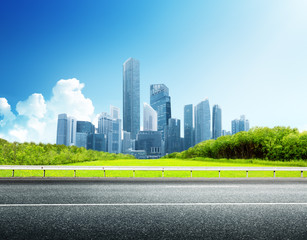 Wall Mural - asphalt road and modern city