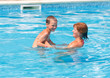 © wildman - Mother with her son in the pool.