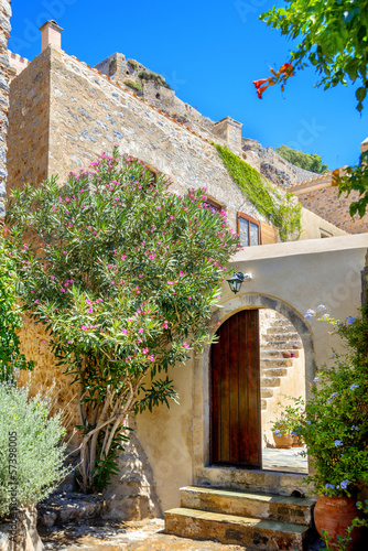 Fototapeta do kuchni greece monemvasia view of stone houses with colorful flowers amo