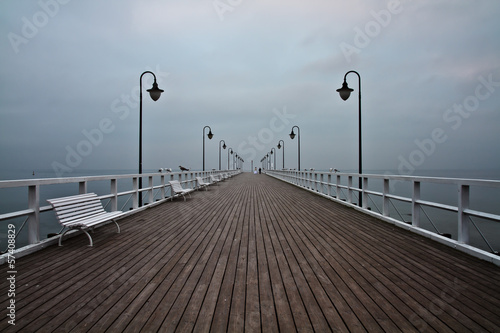 Naklejka na szybę Sunrise on the pier at the seaside, Gdynia Orlowo, Poland. Long 