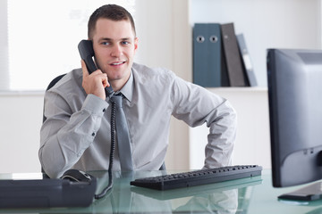 Wall Mural - Businessman listening carefully to caller