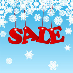 Wall Mural - Sale word in red on a blue background with white snowflakes.seas