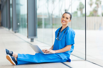 Wall Mural - medical worker sitting on hospital floor