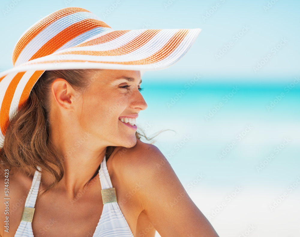 Portrait of happy young woman in swimsuit and beach hat Stock Photo ...