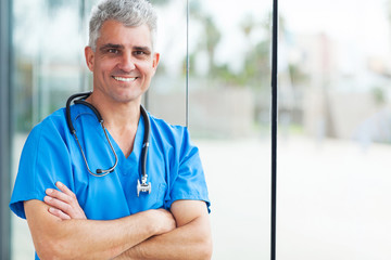 Wall Mural - middle aged surgeon with arms folded