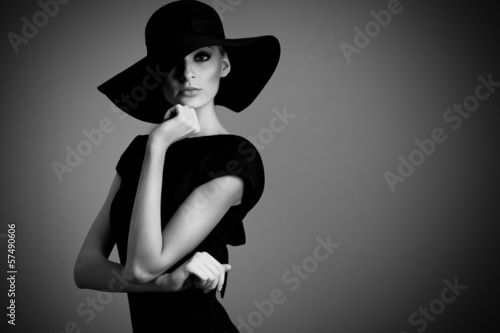 Naklejka na szybę high fashion portrait of elegant woman in black and white hat an