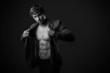 © MaxFrost - Young handsome macho man with muscle abdominal and open jacket