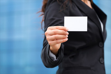 Businesswoman showing business card