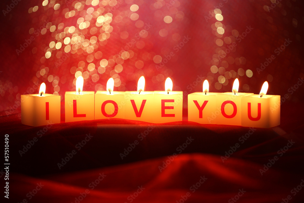 Candles with printed sign I LOVE YOU,on  bright background