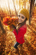 © gpointstudio - Happy woman have fun with leaves during the autumn
