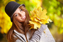Happy Fall Woman Smiling Joyful And Blissful Holding Autumn Leav