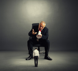 Canvas Print - angry boss screaming at small worker