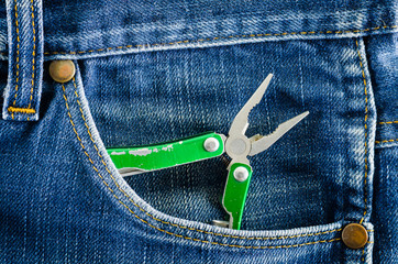 Pliers in blue jeans pocket