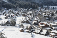 Thatched Roof Houses Covered In Snow In Winter