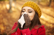 © gpointstudio - Woman sneezing in handkerchief at autumn