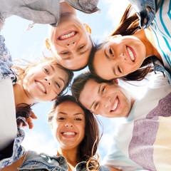 Wall Mural - group of teenagers looking down