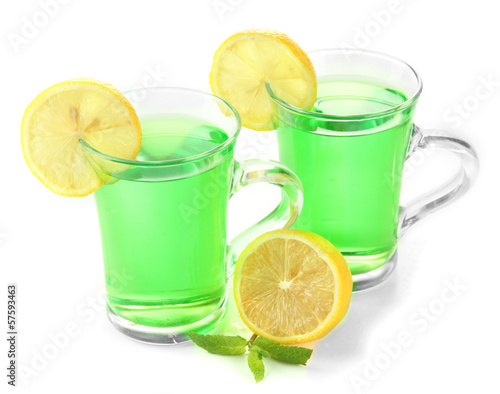 Tapeta ścienna na wymiar Two transparent cups of green tea with mint and lemon isolated