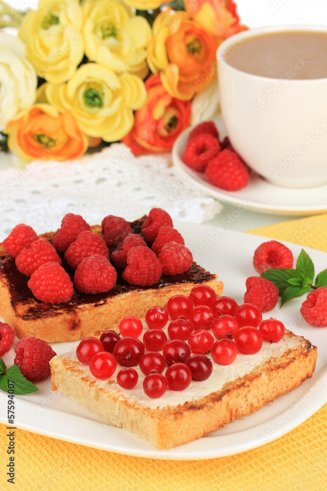 Delicious toast with berries on table close-up
