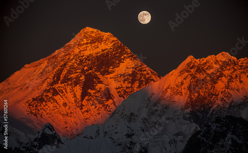 Peak Everest at sunset in a full moon.