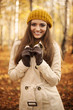 © gpointstudio - Portrait of smiling woman at autumn