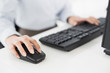 © lightwavemedia - Close-up of hands computer keyboard and mouse