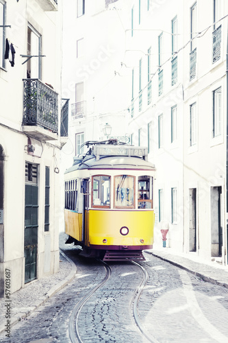 Obraz w ramie yellow ancient tram on streets of Lisbon, Portugal