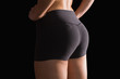 © WavebreakMediaMicro - Mid section of sporty young woman wearing sportswear