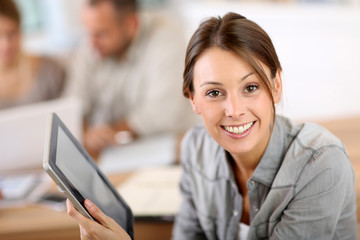 Aufkleber - Young woman using tablet in business training
